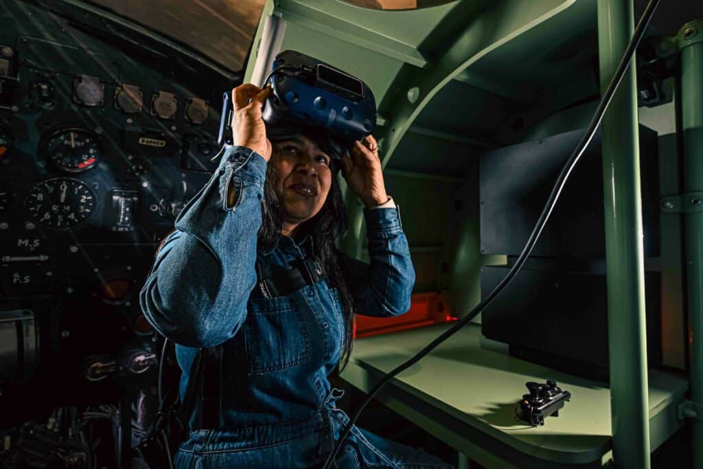 A female visitor adjusts the VR headset