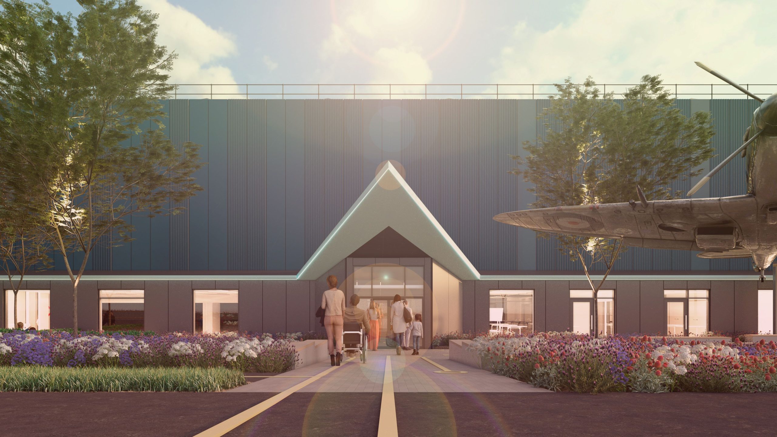 The front of a building with an aircraft to the side and plants in the foreground. People walking along a central path into the building.