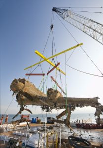 This image shows the lifting of the Dornier Do 17 from the Thames Estuary using specialist equipment.
