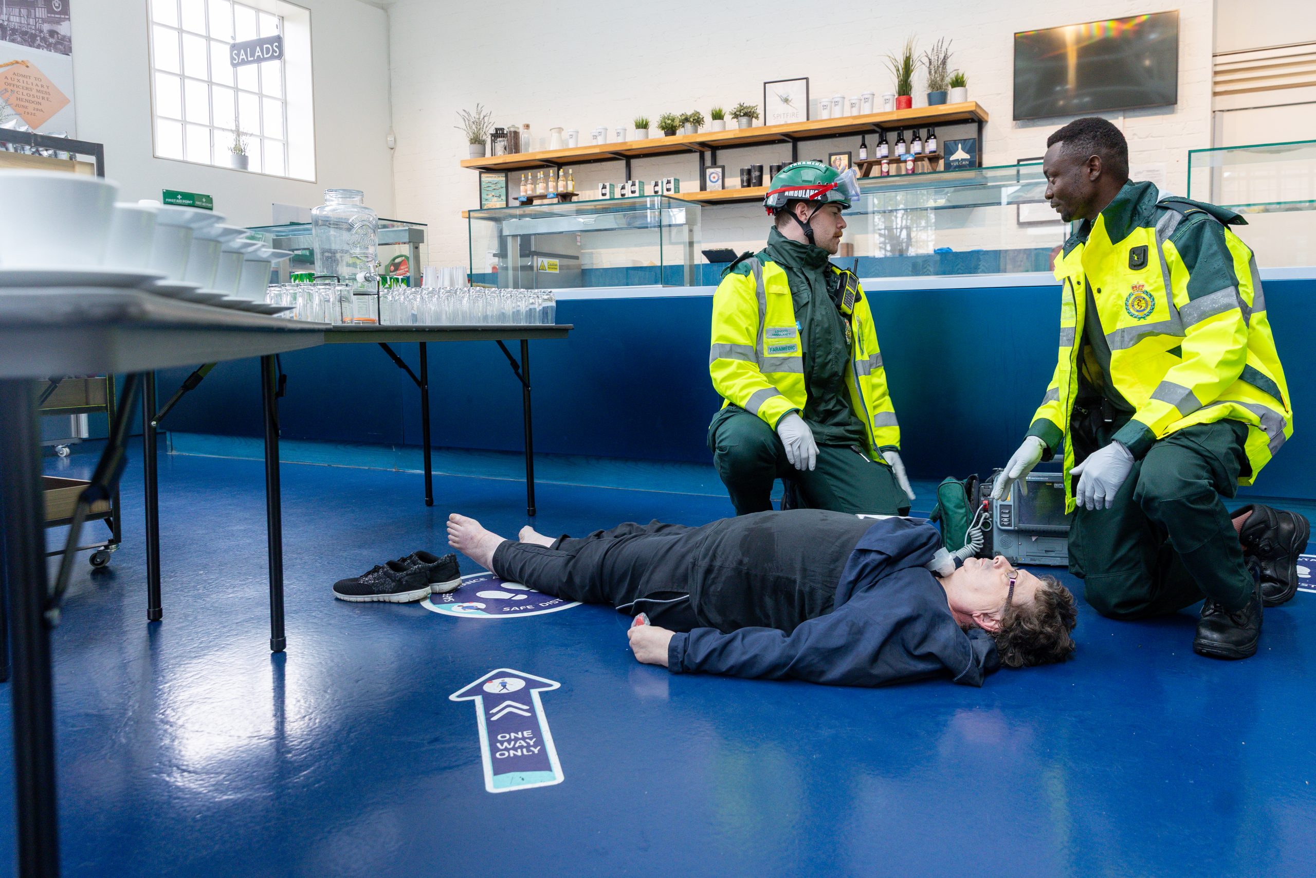 An Exercise Volunteer receiving medical assistance from a London Ambulance Crew