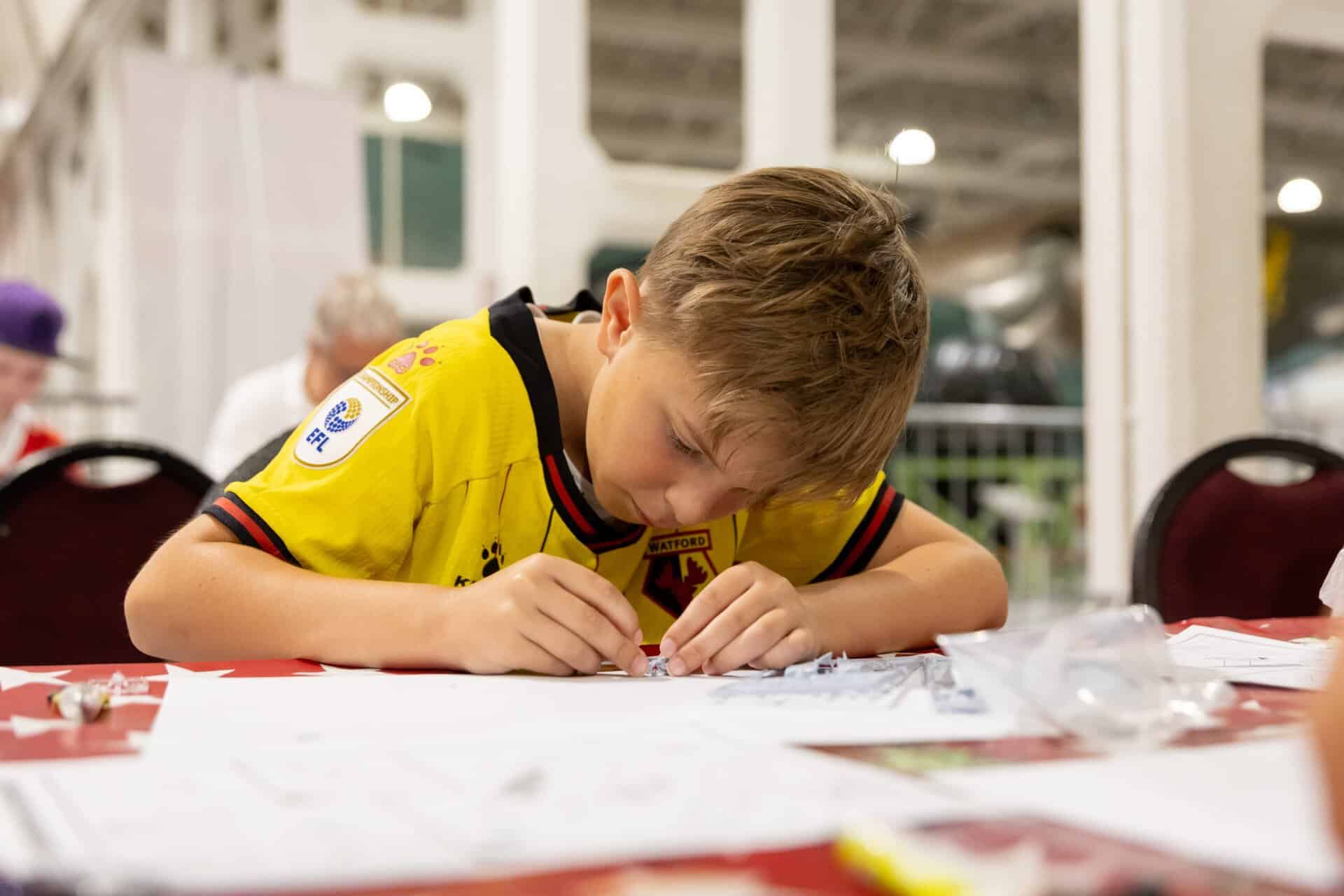 A Young visitor taking part in the club