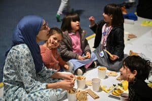 a family gathers round to break the fast together