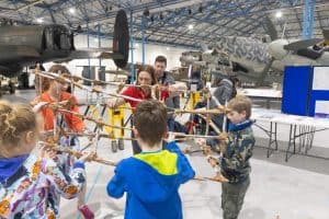 A group of children taking part in an engineering challenge