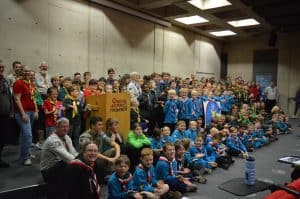 A large gathering of Scouts Packs in the lecture theatre at the Royal Air Force Museum.