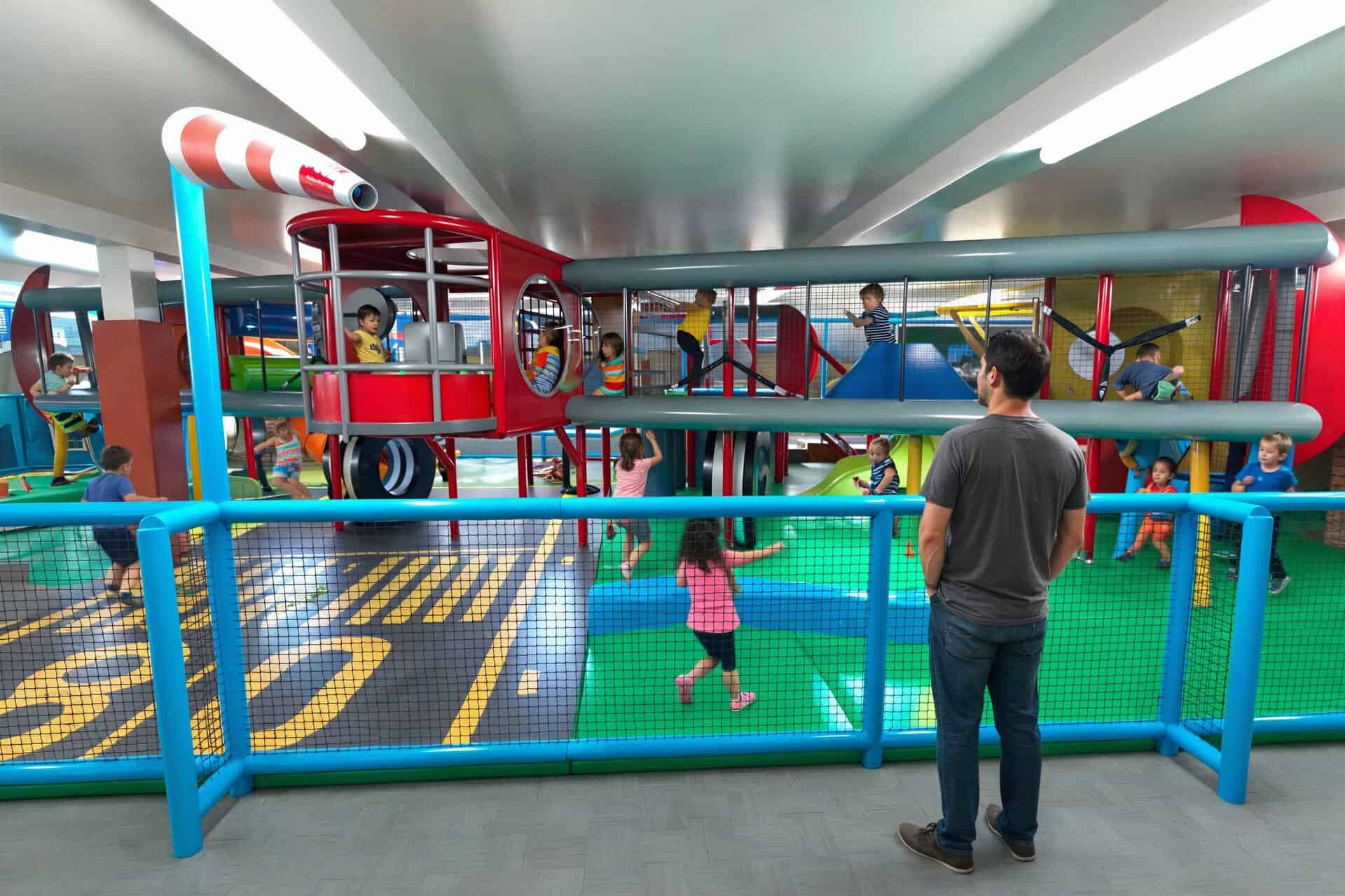 Parents relaxing in AeroPlay seating area