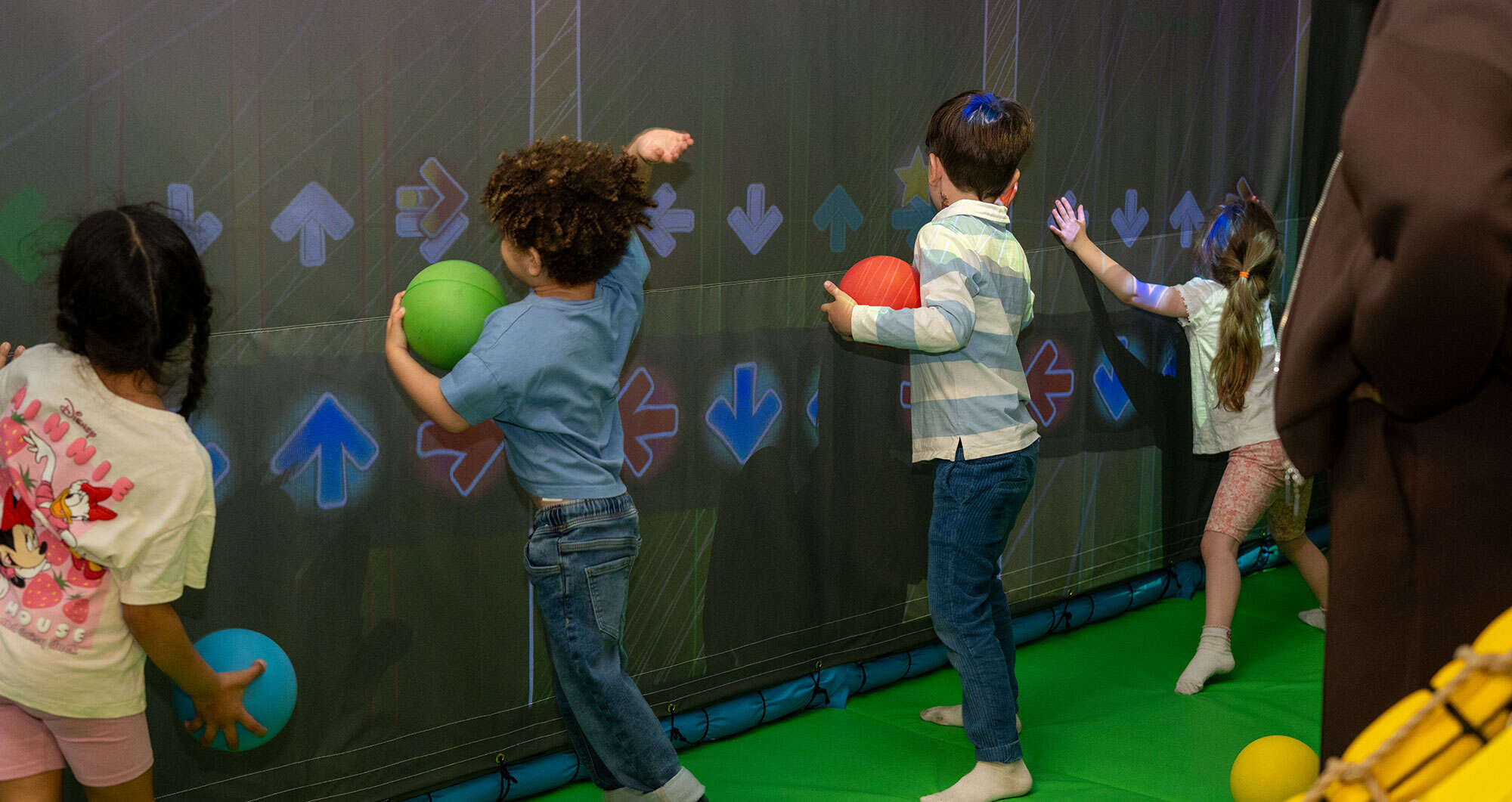 Kids playing with the interactive wall games