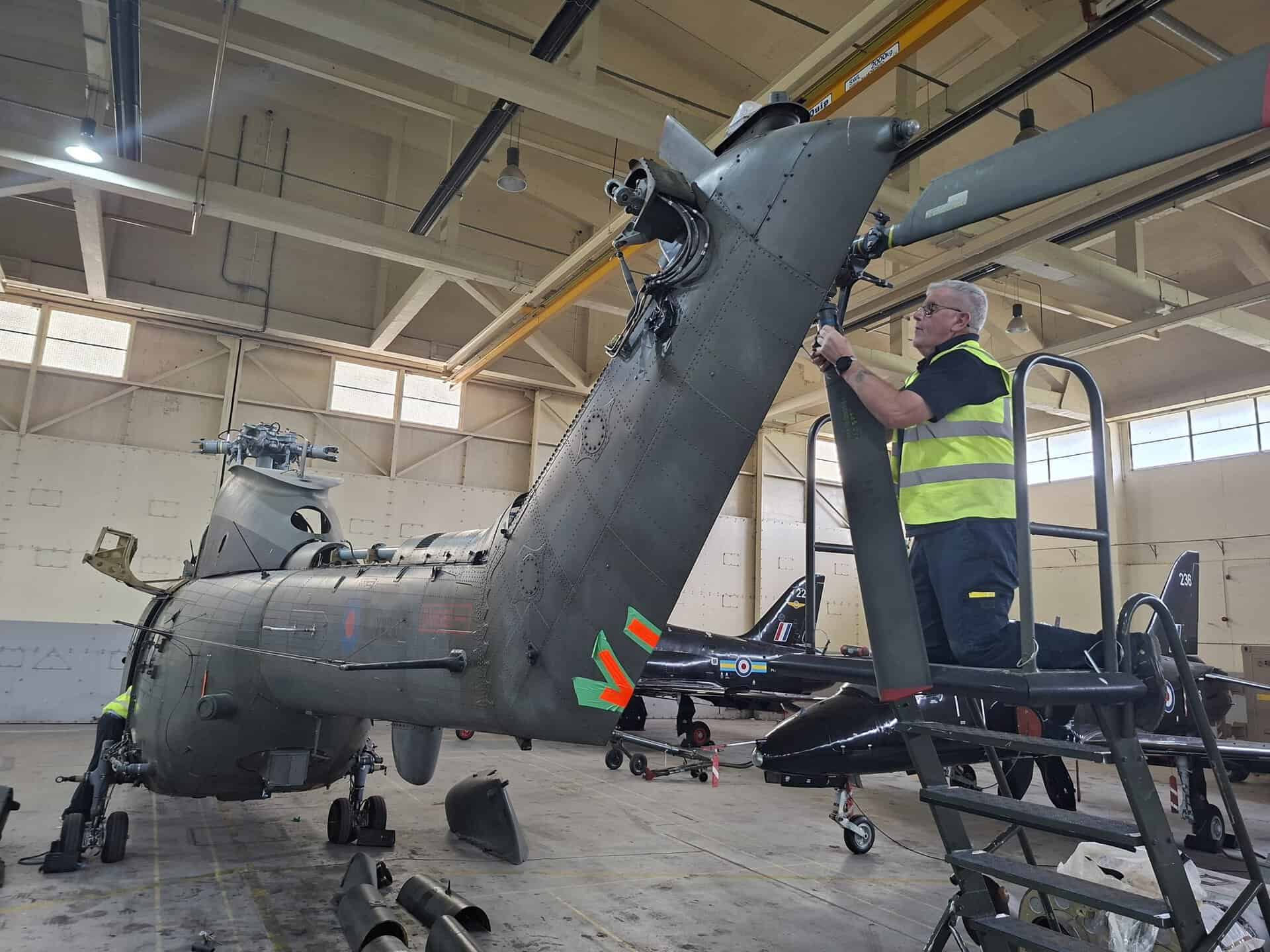 RAF Museum Technician works on the Westland Puma HC1