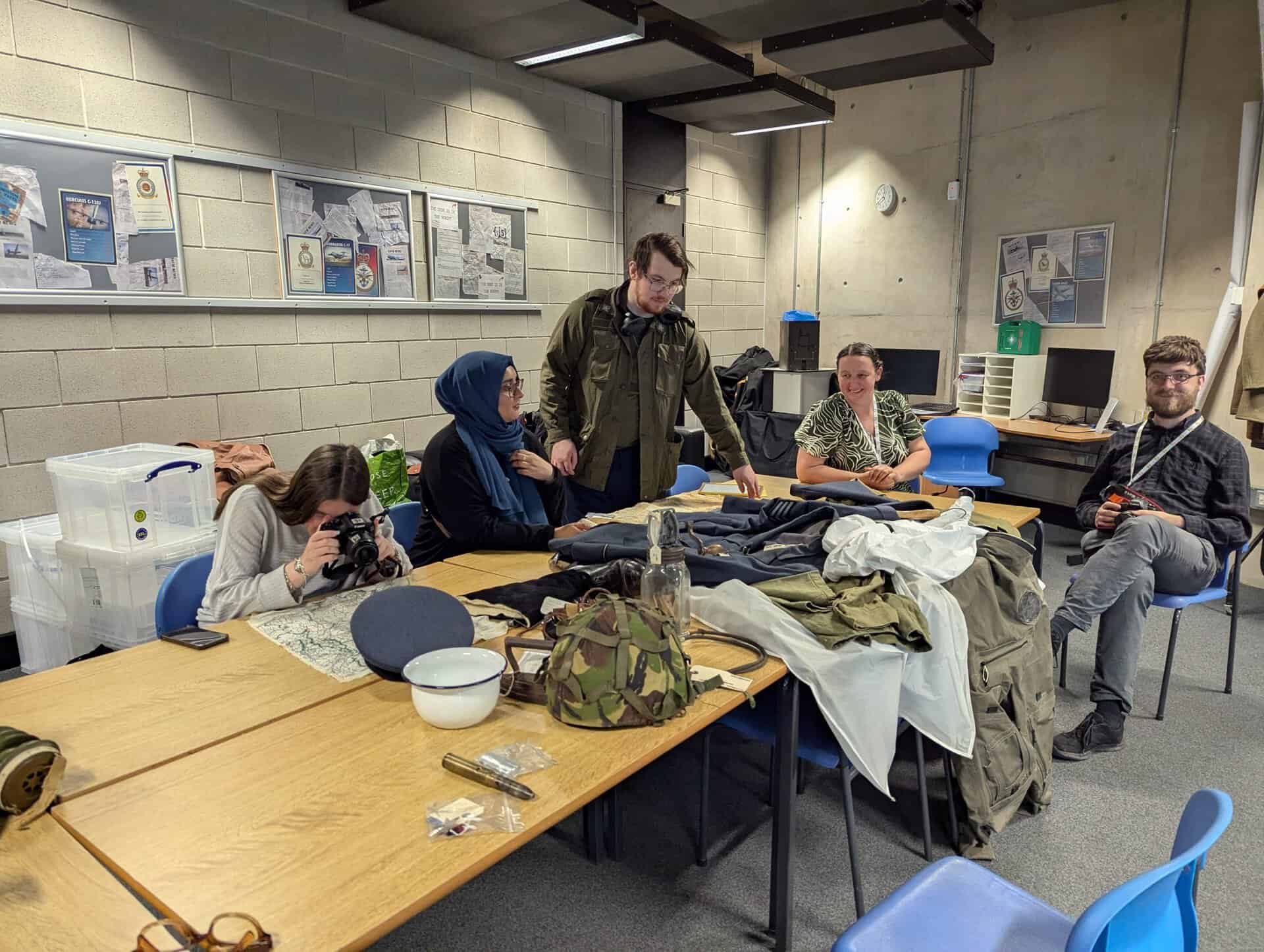 A group of people sitting around a table.  
