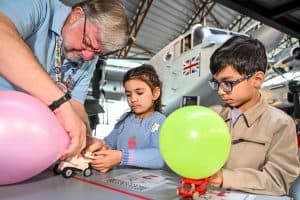 Children building Lego racers